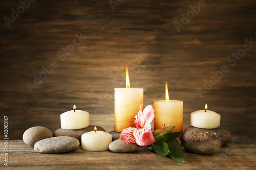 Beautiful composition with candles and spa stones