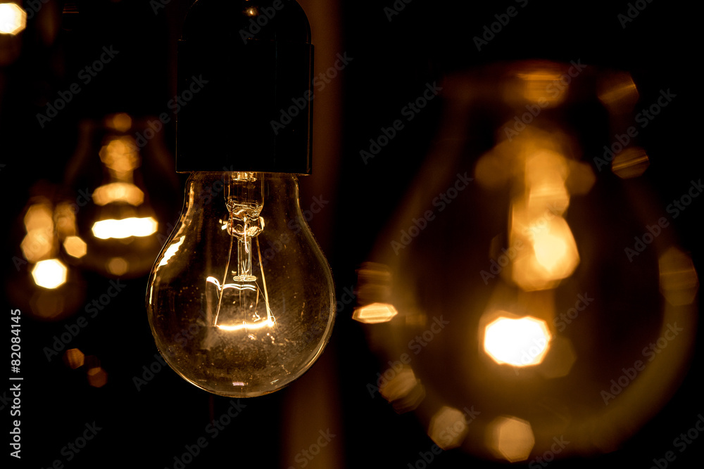 line of lamps in a dark background