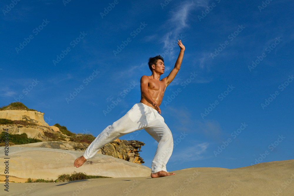 Man doing exercise outdoors on rock Man doing exercise outdoors on rock