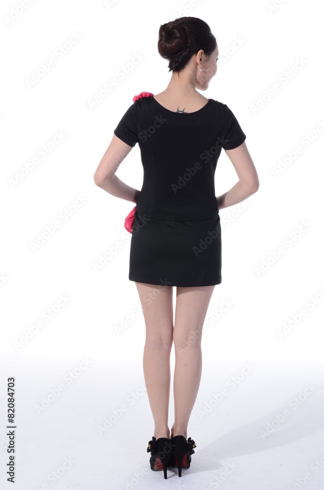 Fototapeta premium Active girl wear professional attire in front of a white backgro