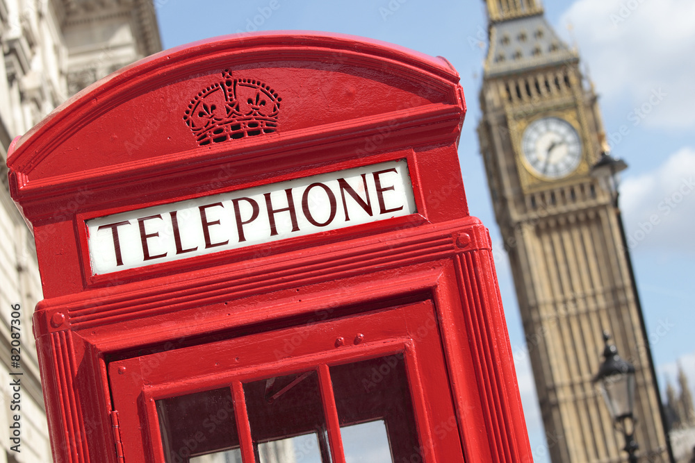 London red telephone box booth with westminster british houses of parliament building and Big Ben clock tower in the background photo London red telephone box booth with westminster british houses of parliament building and Big Ben clock tower in the background photo