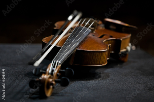 Violin lying in dark colors