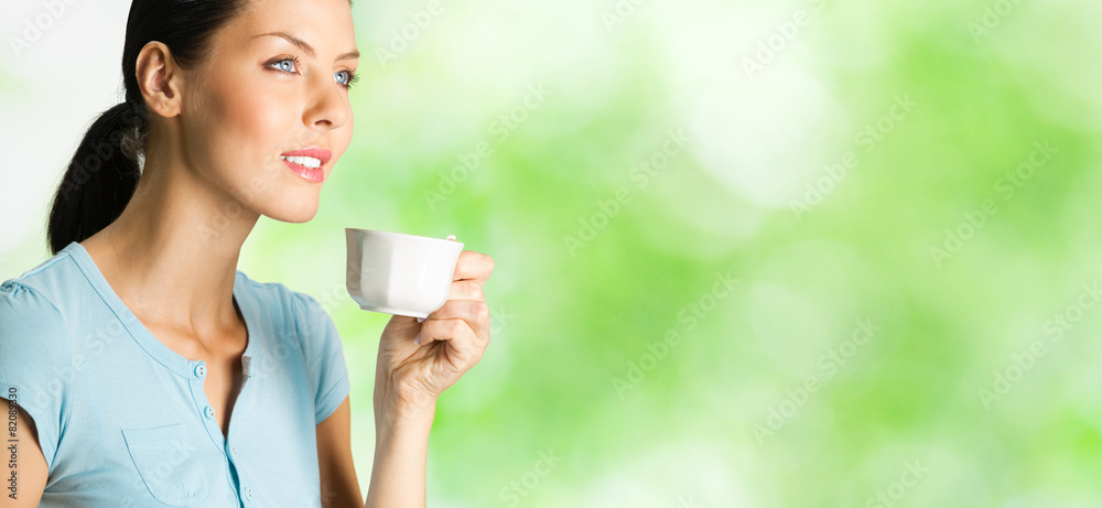Happy woman drinking coffee, outdoor Happy woman drinking coffee, outdoor
