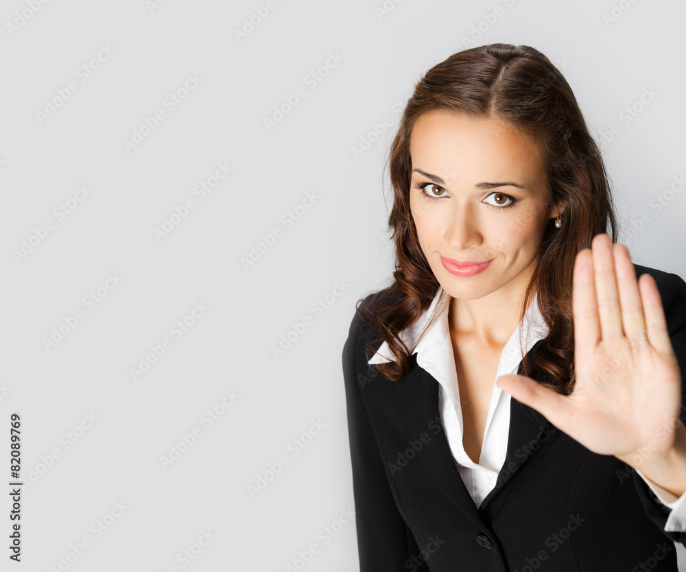 Businesswoman with stop gesture, with copyspace