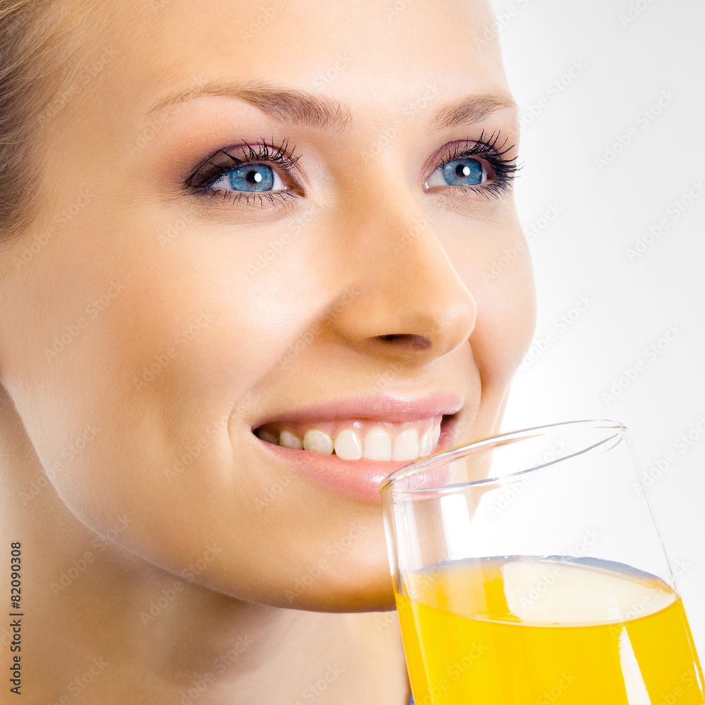 Woman drinking orange juice Woman drinking orange juice