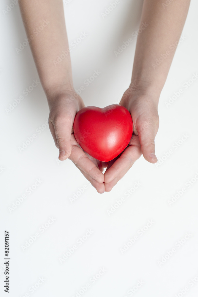 red heart in hands red heart in hands