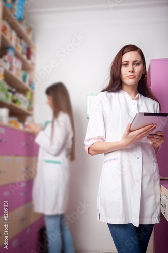 Woman doctor with digital tablet in hands