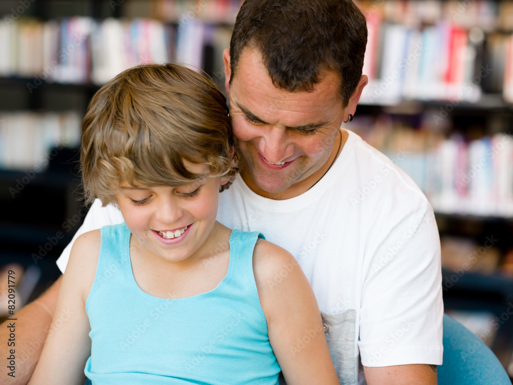 Father with son in library Father with son in library