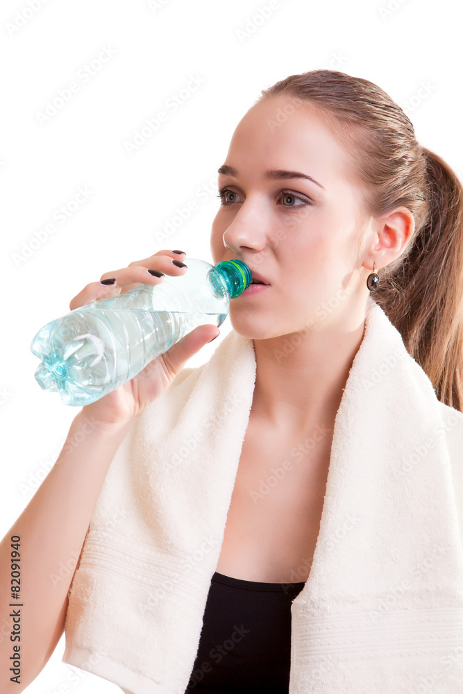 Cute teenager with bottle of water in hands Cute teenager with bottle of water in hands