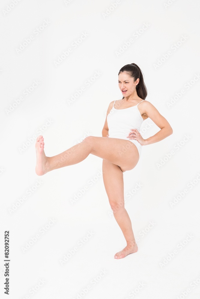 Fit woman practicing karate