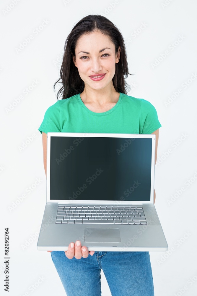 Smiling brunette showing her laptop Smiling brunette showing her laptop