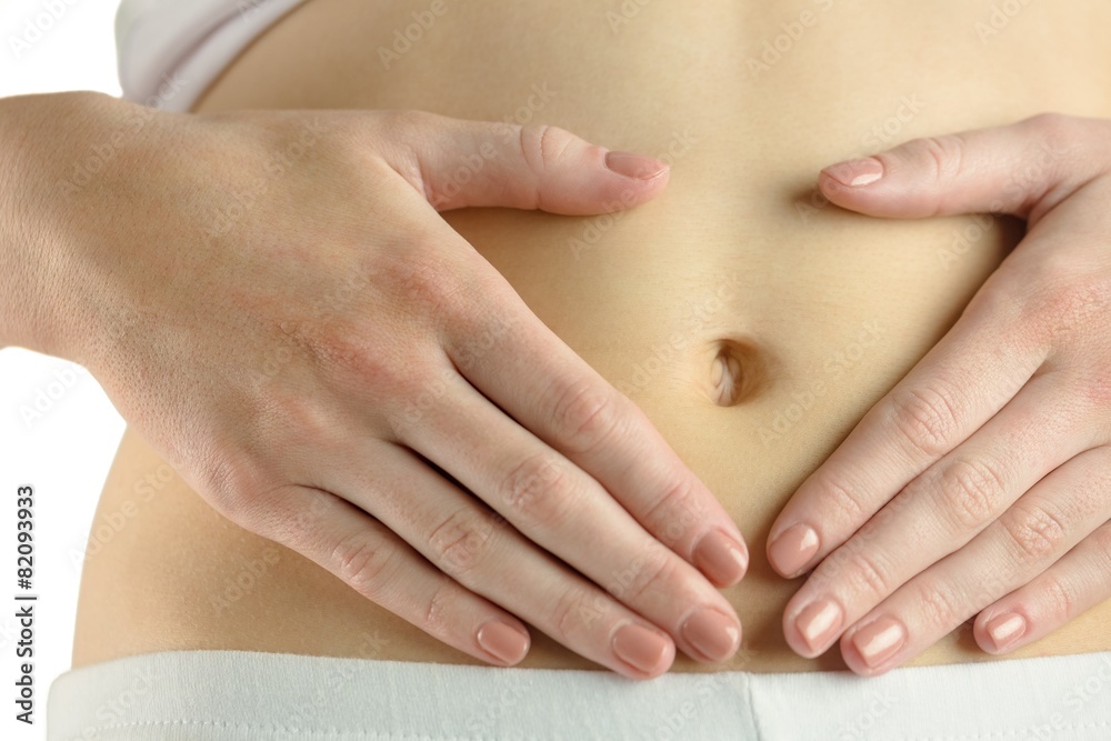Fototapeta premium Slim woman touching her belly