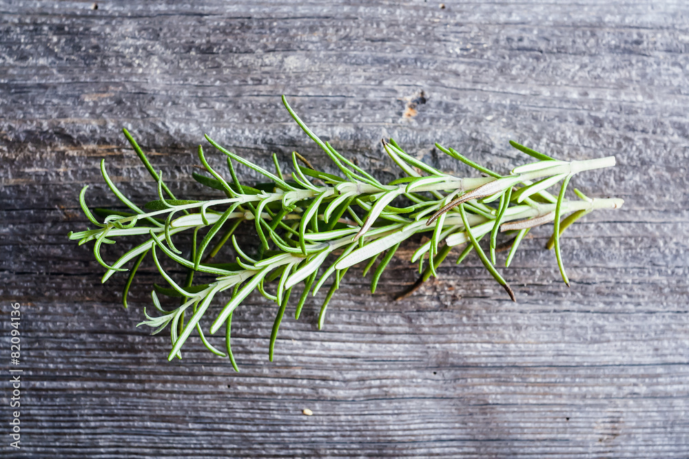 sprigs of fresh rosemary on the table sprigs of fresh rosemary on the table