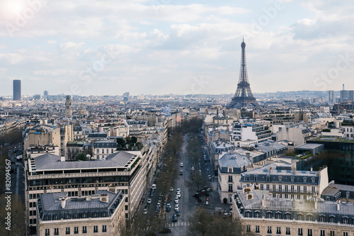 Aerial view of the city with blue cloudy sky and Eiffel Tower fr