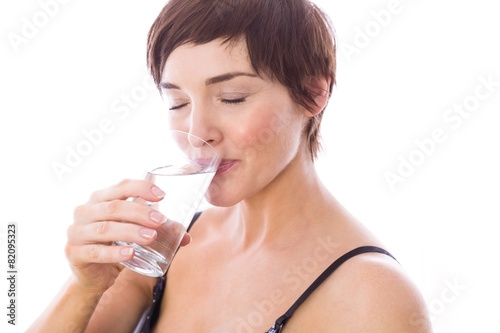 Pregnant woman drinking glass of water