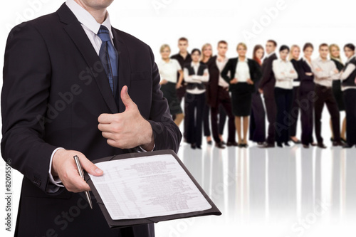 Businessman giving a contract to you