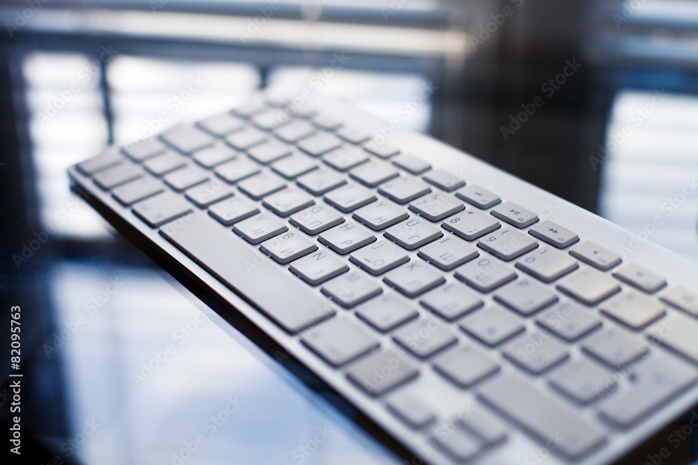 beautiful modern keyboard on the glass table