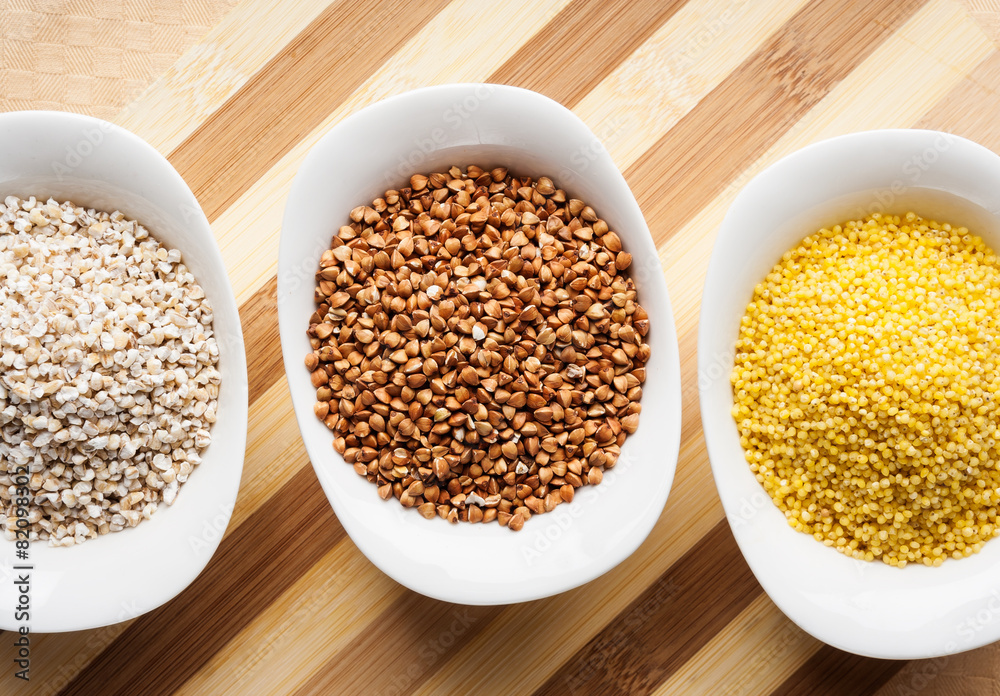 Three kinds of groats: buckwheat, millet and barley groats Three kinds of groats: buckwheat, millet and barley groats