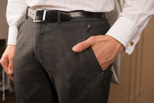 man in formalwear put his hand in his pocket
