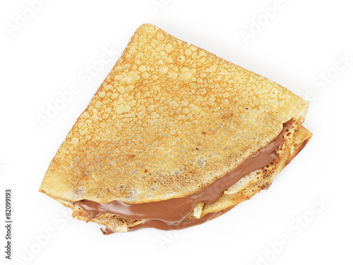 Fotografía fresh hot blinis or crepes  with chocolate spread isolated on