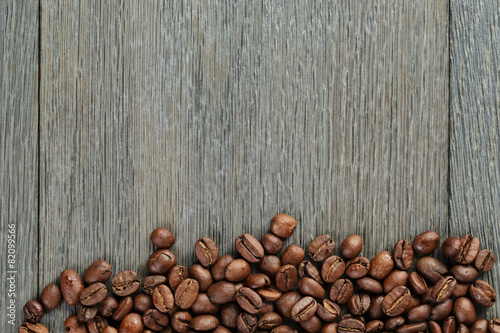 freshly roasted coffee beans on wooden table