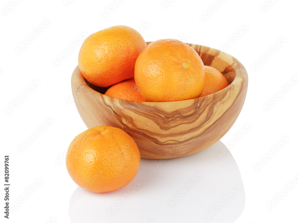 ripe tangerines in wood bowl, isolated on white ripe tangerines in wood bowl, isolated on white
