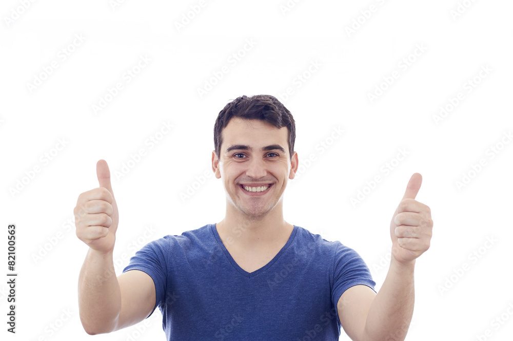 Smiling excited young man with thumb Smiling excited young man with thumb