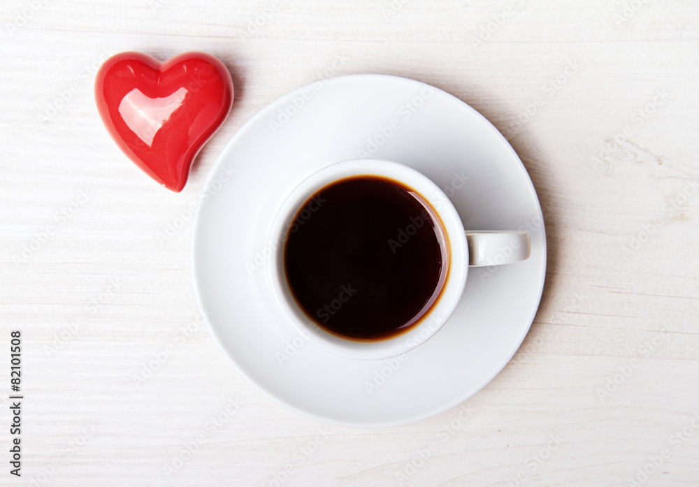 aromatic coffee with red heart on white wood background aromatic coffee with red heart on white wood background