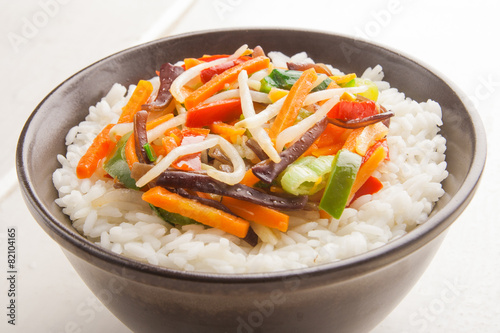 A bowl of rice with vegetables
