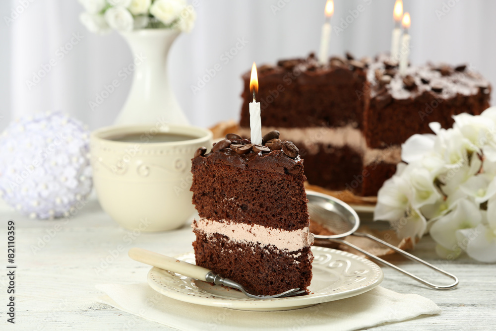 Delicious chocolate cake on table on light background Delicious chocolate cake on table on light background