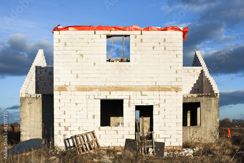 Construction of the new white brick house