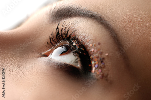 Female eye with fancy glitt...