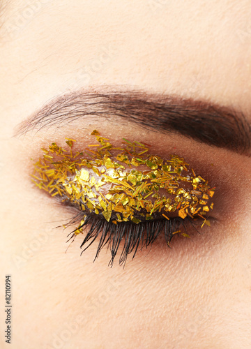 Female eye with fancy glitt...