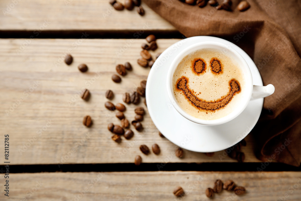 Obraz premium Cup of coffee on old wooden table