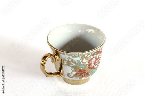 Elegant Antique china tea cup and saucer on white background