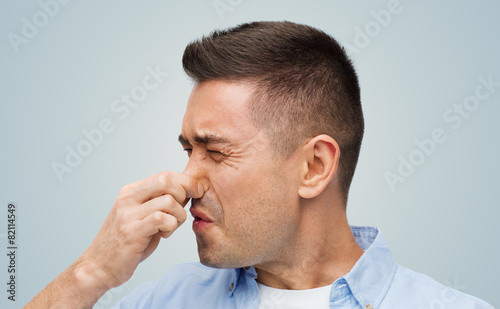 Принти на полотні man wrying of unpleasant smell