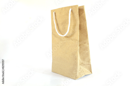 Blank brown paper bag on white background