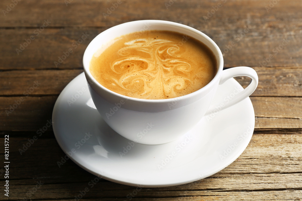 Cup of coffee latte art on wooden background