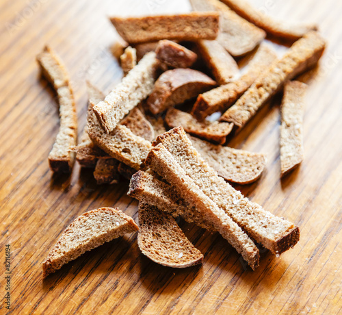 Croutons of brown bread photo