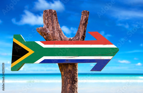 South Africa Flag wooden sign with beach background