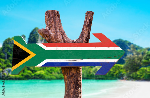 South Africa Flag wooden sign with beach background