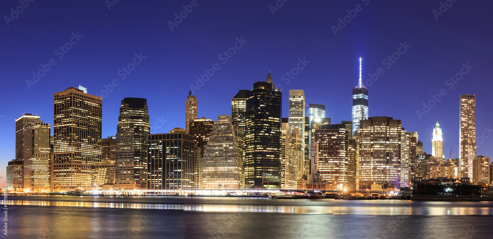 New York City Manhattan midtown at dusk with skyscrapers illumin