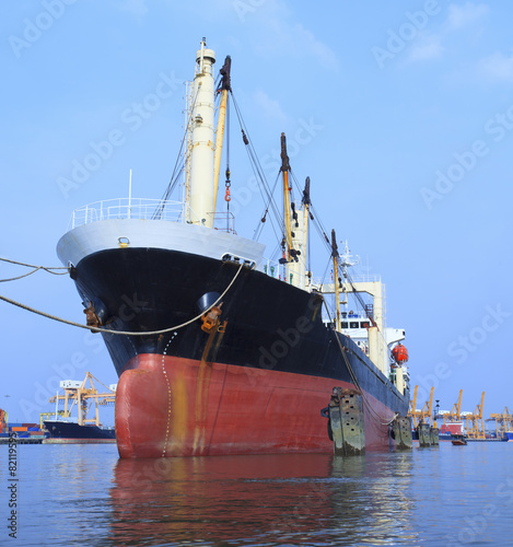 commercial container ship floating on river port use for import