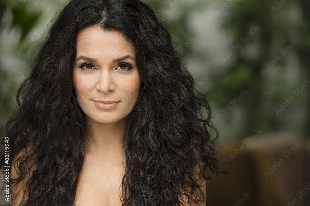 Hispanic woman standing outdoors Hispanic woman standing outdoors