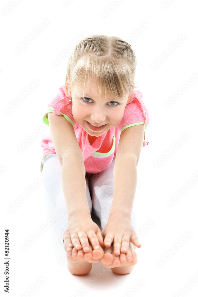 Little girl doing exercises isolated on white Little girl doing exercises isolated on white