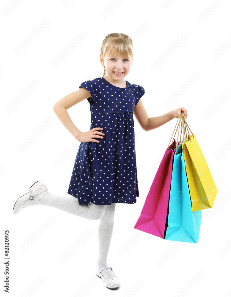 Beautiful little girl with shopping bags isolated on white Beautiful little girl with shopping bags isolated on white