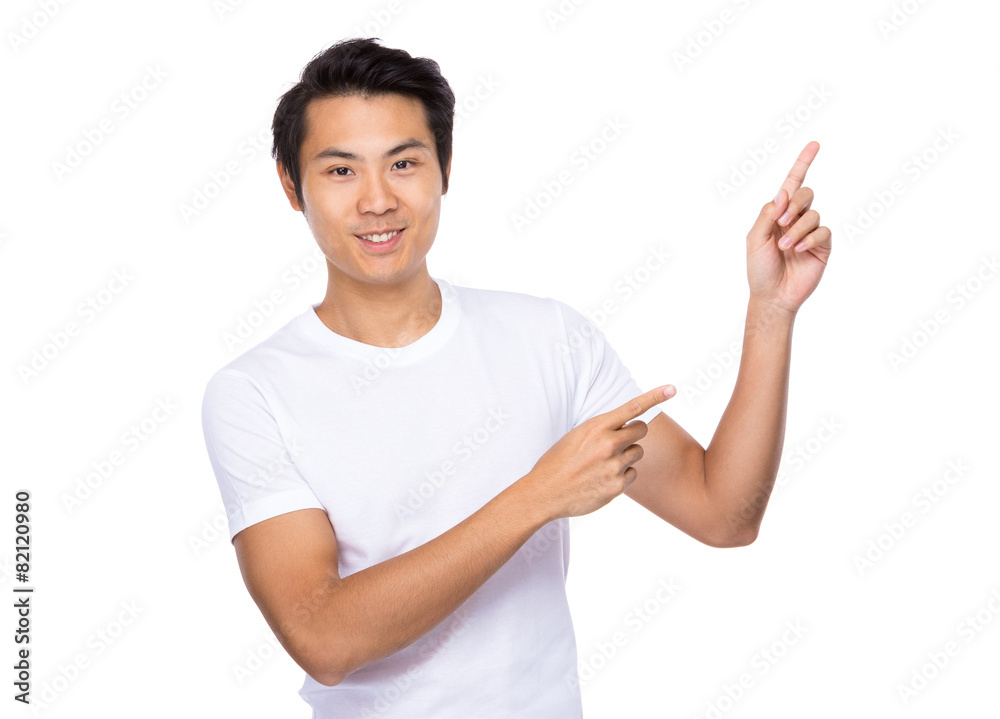 Young man with two finger pointing up Young man with two finger pointing up