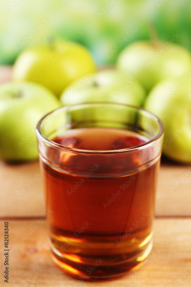 Glass of healthy fresh juice of apples on wooden background Glass of healthy fresh juice of apples on wooden background