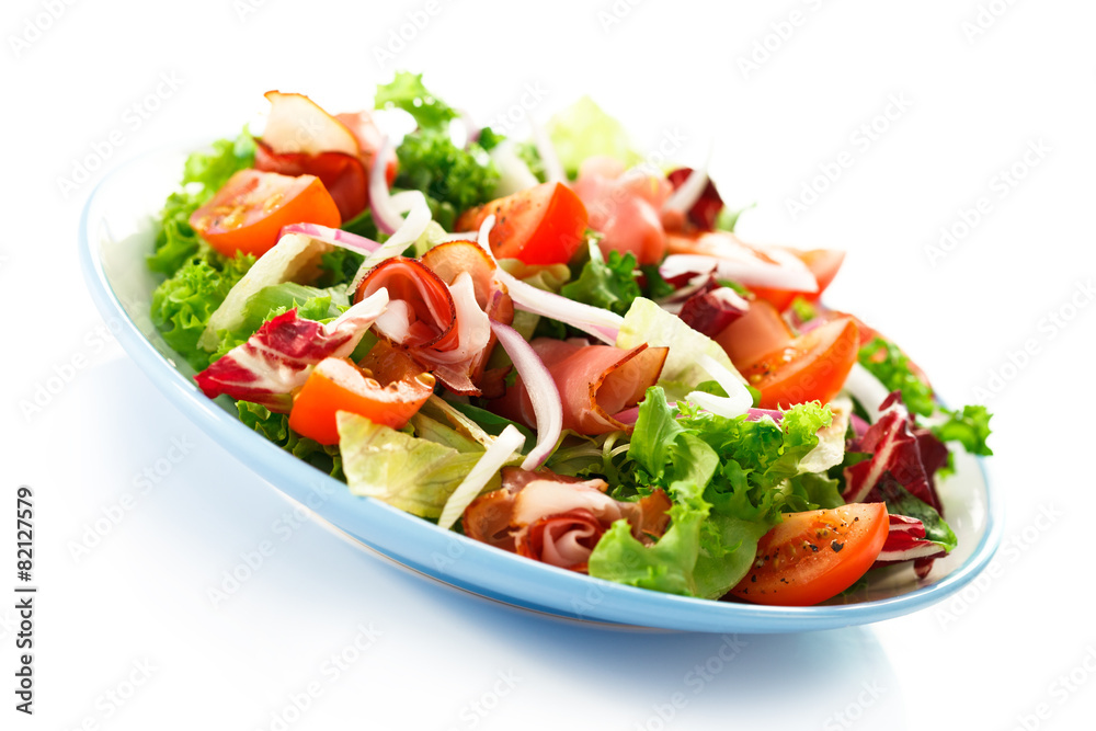 Smoked ham and vegetables on white background