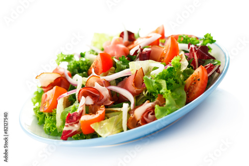 Smoked ham and vegetables on white background